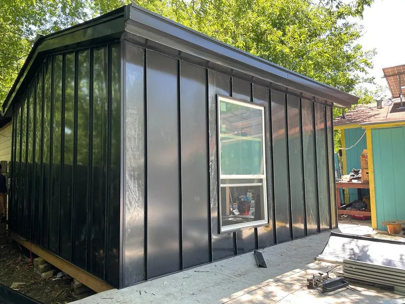 Black standing seam metal wall panels for Roof Inspection in St. Clair