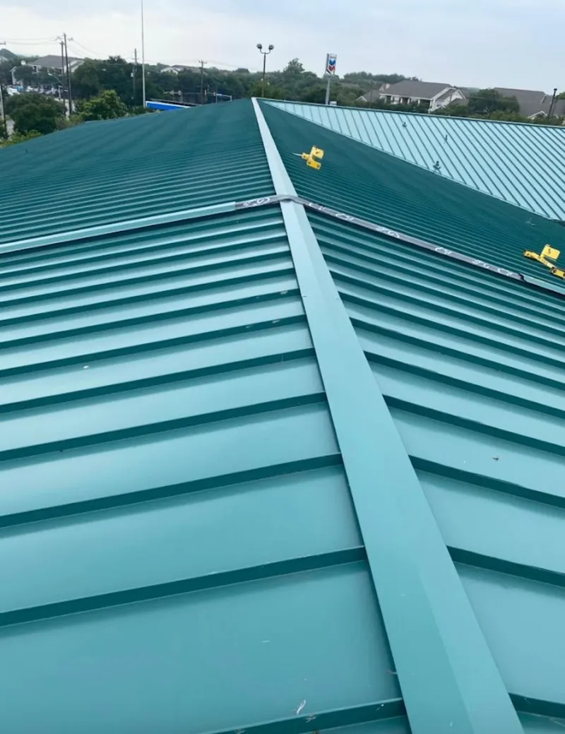 Green commercial metal roof ridge and valley for Metal Roof Repair in St. Clair